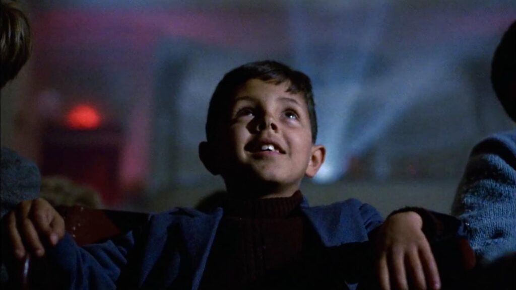 image from Cinema Paradiso, with boy sitting in theater