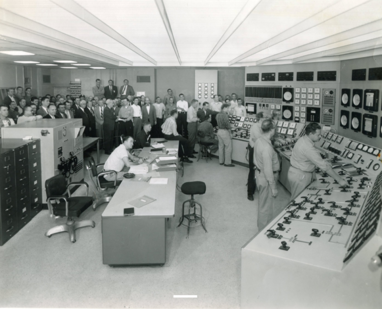 People working in control room of a power station